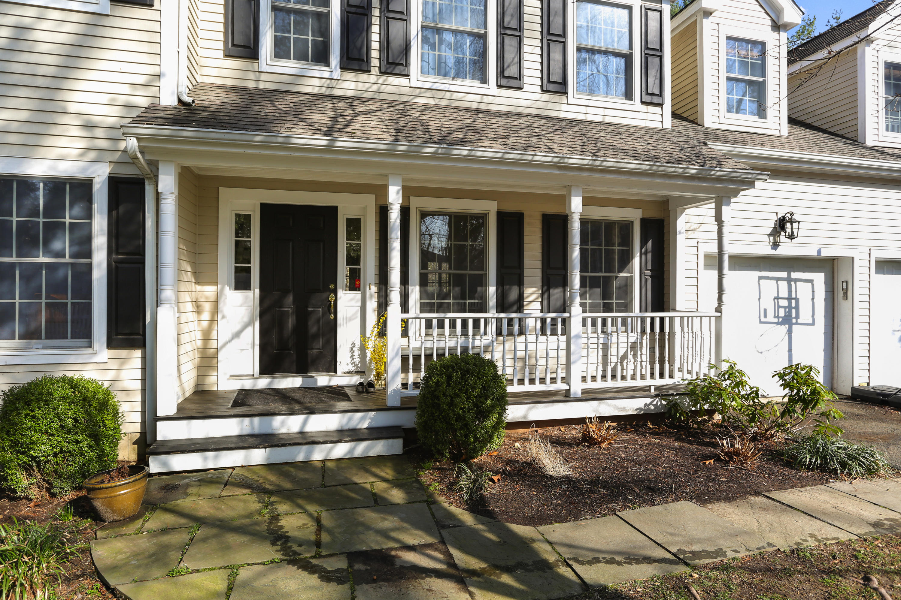2 Old Field Road Norwalk, CT 06853 - Photo 4 of 23 front view of a brick house with a large windows