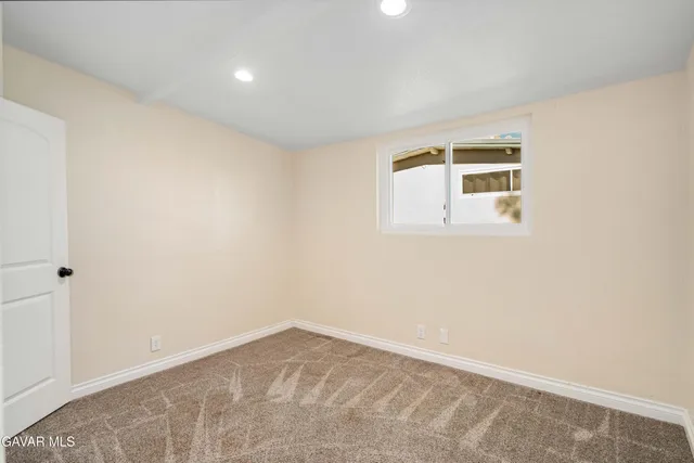 a view of a kitchen with a tub and chairs