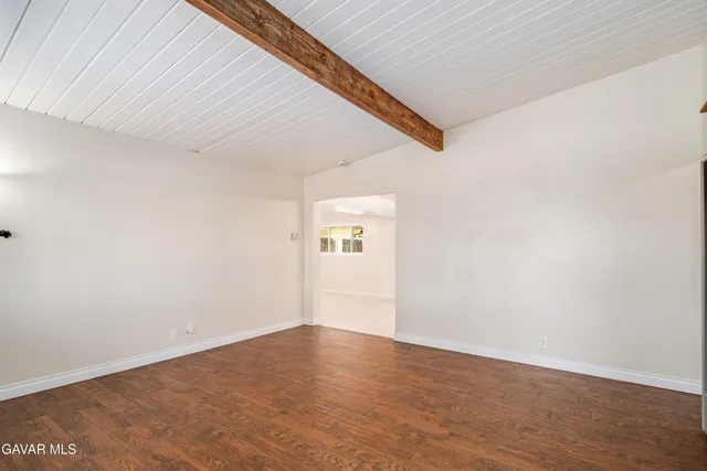 a kitchen with stainless steel appliances granite countertop a stove microwave and cabinets