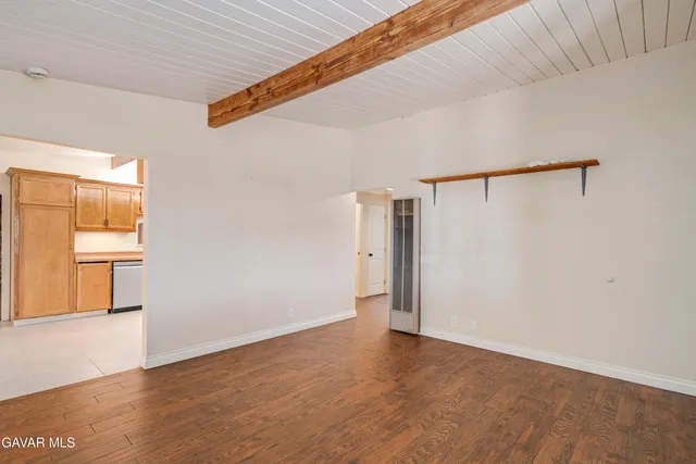 a kitchen with granite countertop cabinets stainless steel appliances and a sink