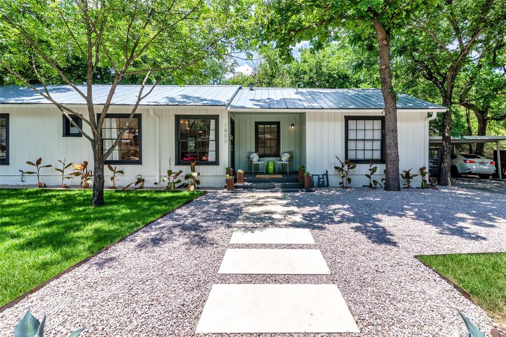 1800 Winsted Lane, Unit A Austin, TX 78703 - Photo 1 of 22 a front view of a house with garden