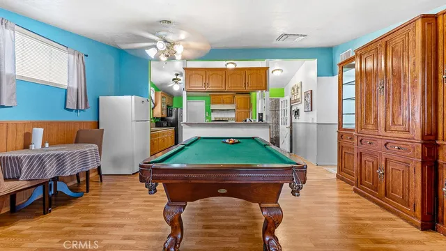 a room with furniture a rug and a flat screen tv