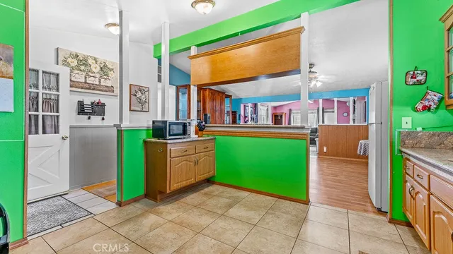 a view of a chair and tables in the patio