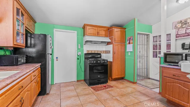 a room with pool table and windows