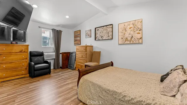 a bedroom with a bed and a dresser