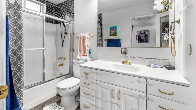 a kitchen with stainless steel appliances granite countertop a refrigerator and a stove