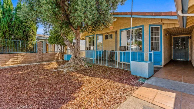 front view of a house with a rug