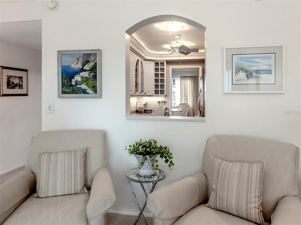 230 Santa Maria Street, Unit 330 Venice, FL 34285 - Photo 12 of 59 a living room with furniture and a painting