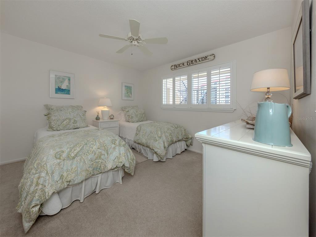230 Santa Maria Street, Unit 330 Venice, FL 34285 - Photo 22 of 59 a bedroom with bed and window