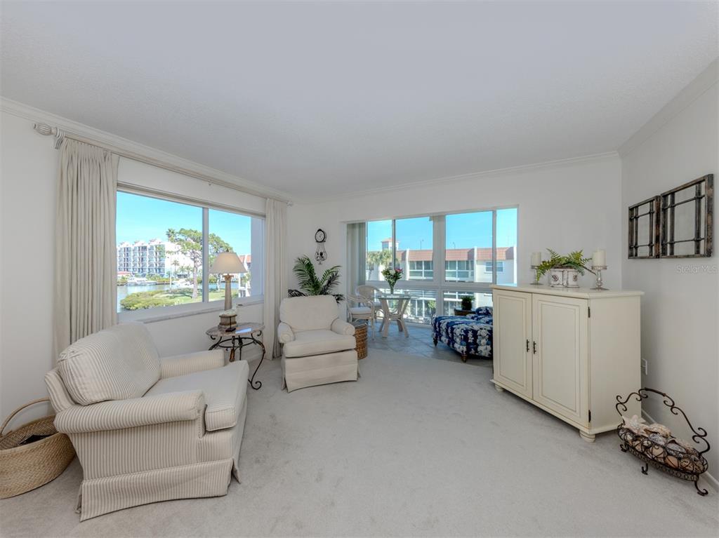230 Santa Maria Street, Unit 330 Venice, FL 34285 - Photo 25 of 59 a living room with furniture and a large window