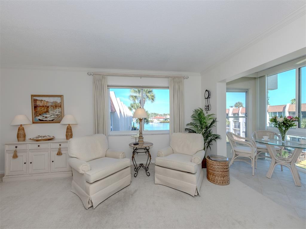 230 Santa Maria Street, Unit 330 Venice, FL 34285 - Photo 26 of 59 a living room with furniture and a large window