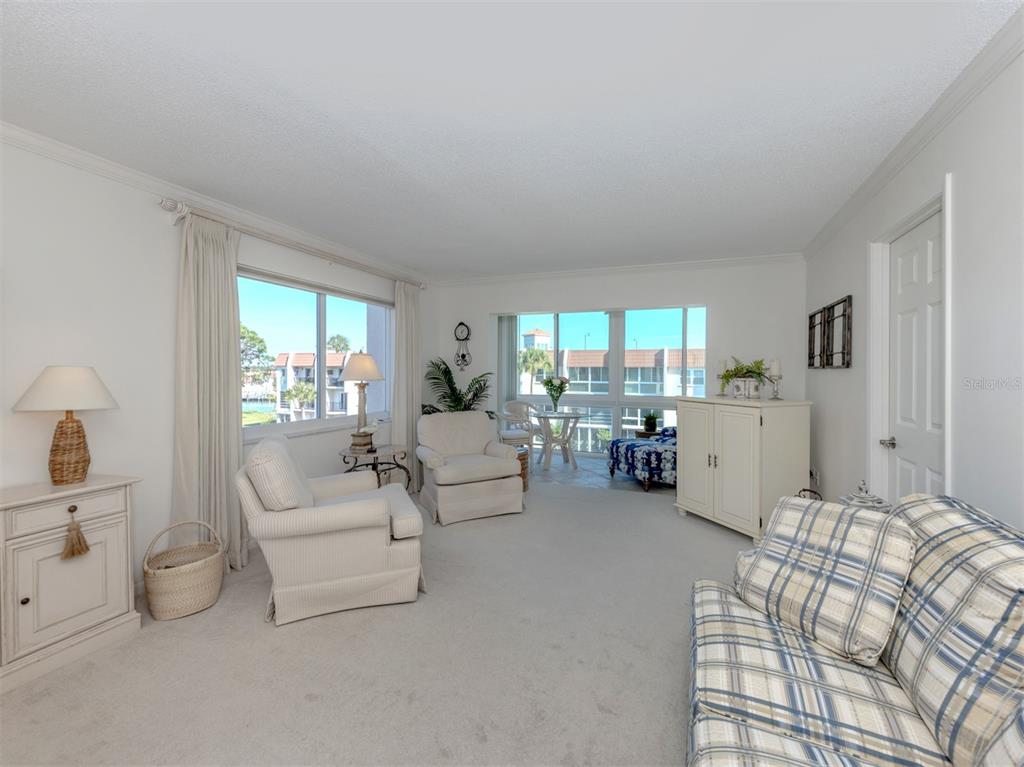 230 Santa Maria Street, Unit 330 Venice, FL 34285 - Photo 27 of 59 a living room with furniture and a large window