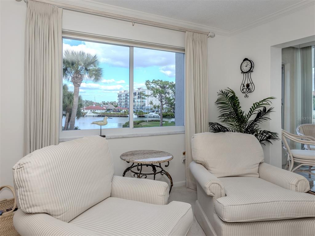 230 Santa Maria Street, Unit 330 Venice, FL 34285 - Photo 31 of 59 a living room with furniture and a large window