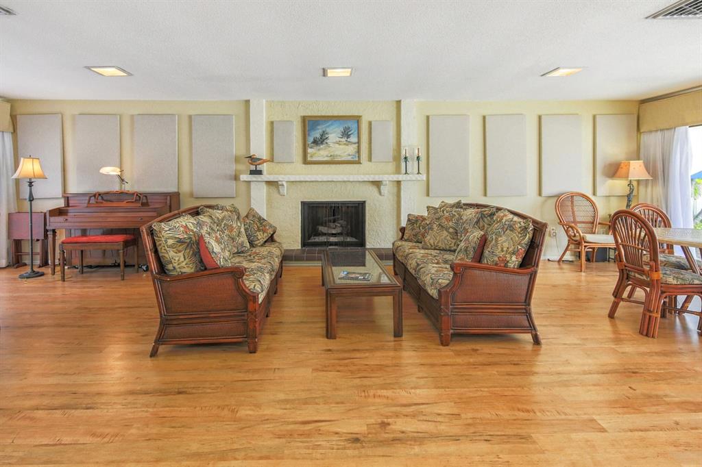 230 Santa Maria Street, Unit 330 Venice, FL 34285 - Photo 39 of 59 a living room with furniture and a fireplace
