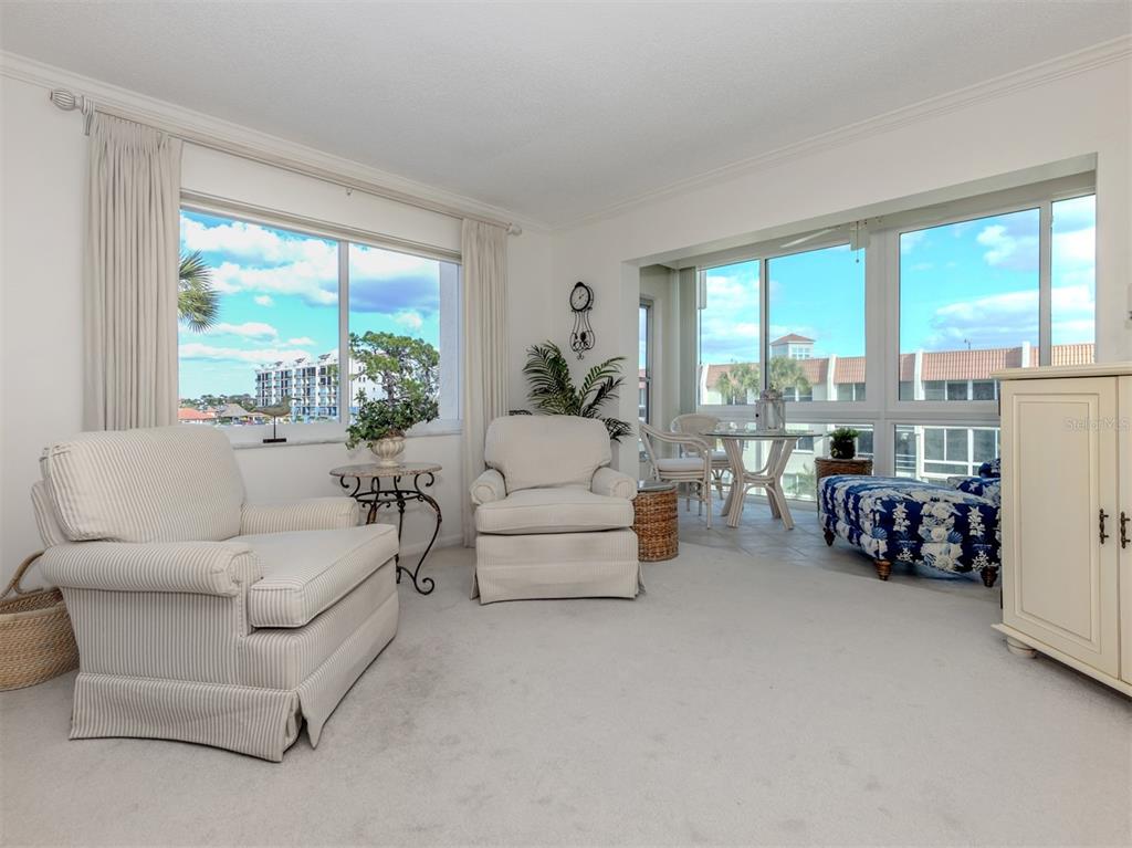 230 Santa Maria Street, Unit 330 Venice, FL 34285 - Photo 4 of 59 a living room with furniture and a large window