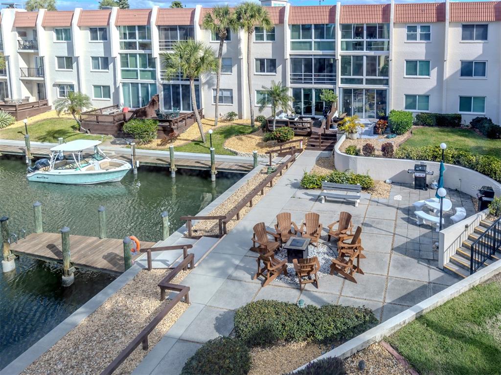 230 Santa Maria Street, Unit 330 Venice, FL 34285 - Photo 9 of 59 a view of a lake with couches and chairs