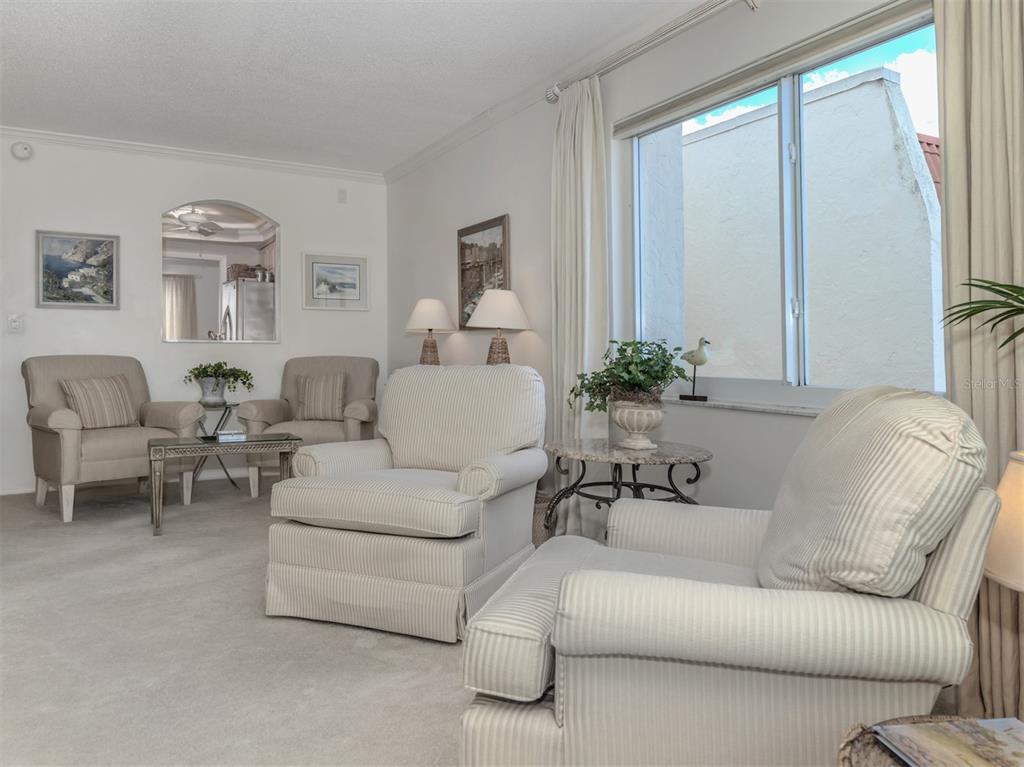 230 Santa Maria Street, Unit 330 Venice, FL 34285 - Photo 10 of 59 a living room with furniture and a large window