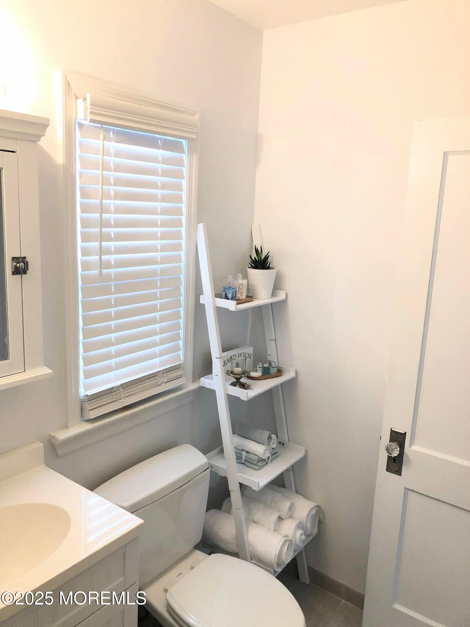 222 Franklin Avenue Seaside Heights, NJ 08751 - Photo 13 of 14 a bathroom with a sink a toilet and tub
