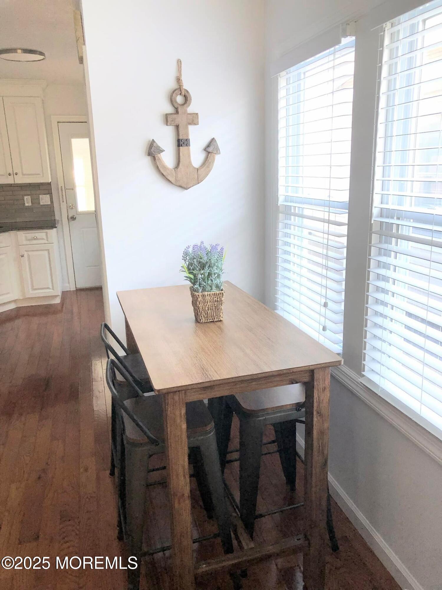 222 Franklin Avenue Seaside Heights, NJ 08751 - Photo 4 of 14 a view of a dining room with furniture and wooden floor
