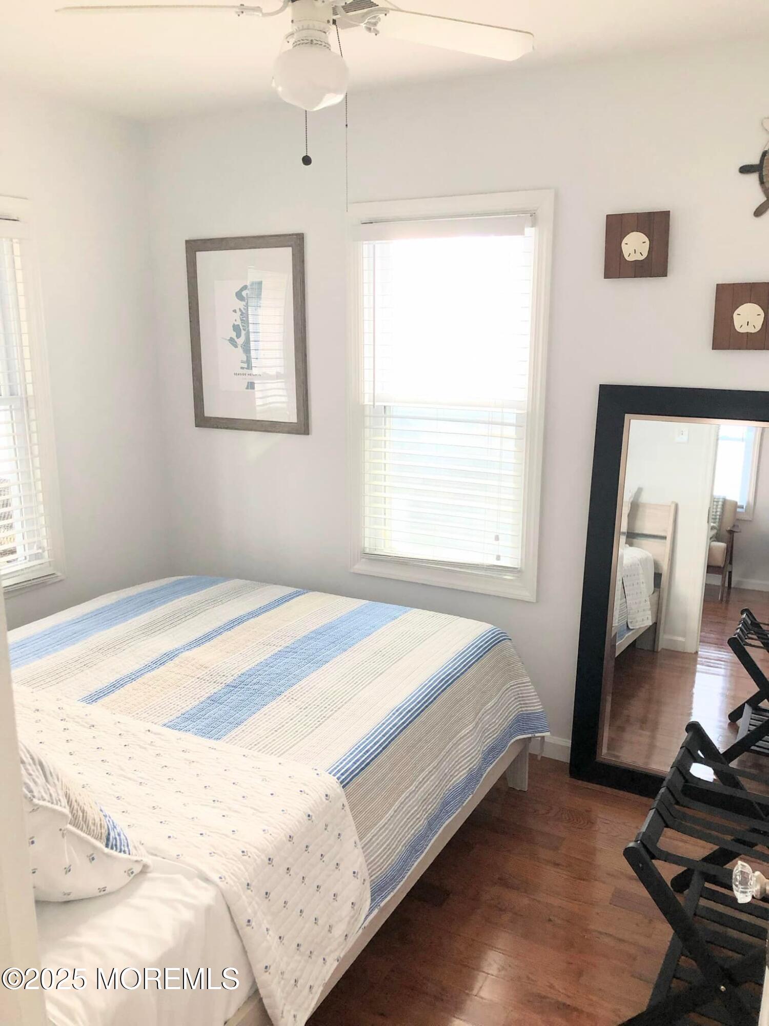 222 Franklin Avenue Seaside Heights, NJ 08751 - Photo 10 of 14 a bedroom with a bed and a mirror
