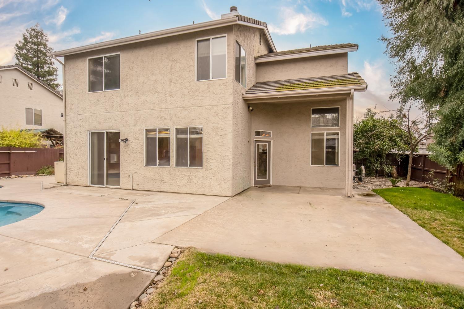 1361 Birch Avenue Clovis, CA 93611 - Photo 11 of 43 a front view of a house with garden