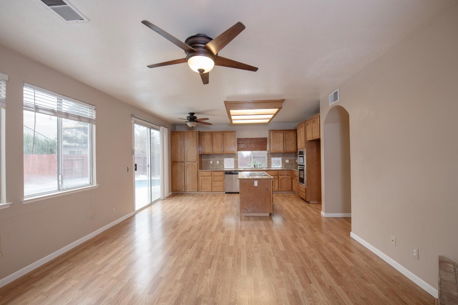 1361 Birch Avenue Clovis, CA 93611 - Photo 17 of 43 a living room with stainless steel appliances furniture and a large window