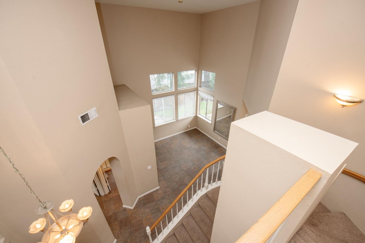 1361 Birch Avenue Clovis, CA 93611 - Photo 27 of 43 a view of a room with wooden floor and windows