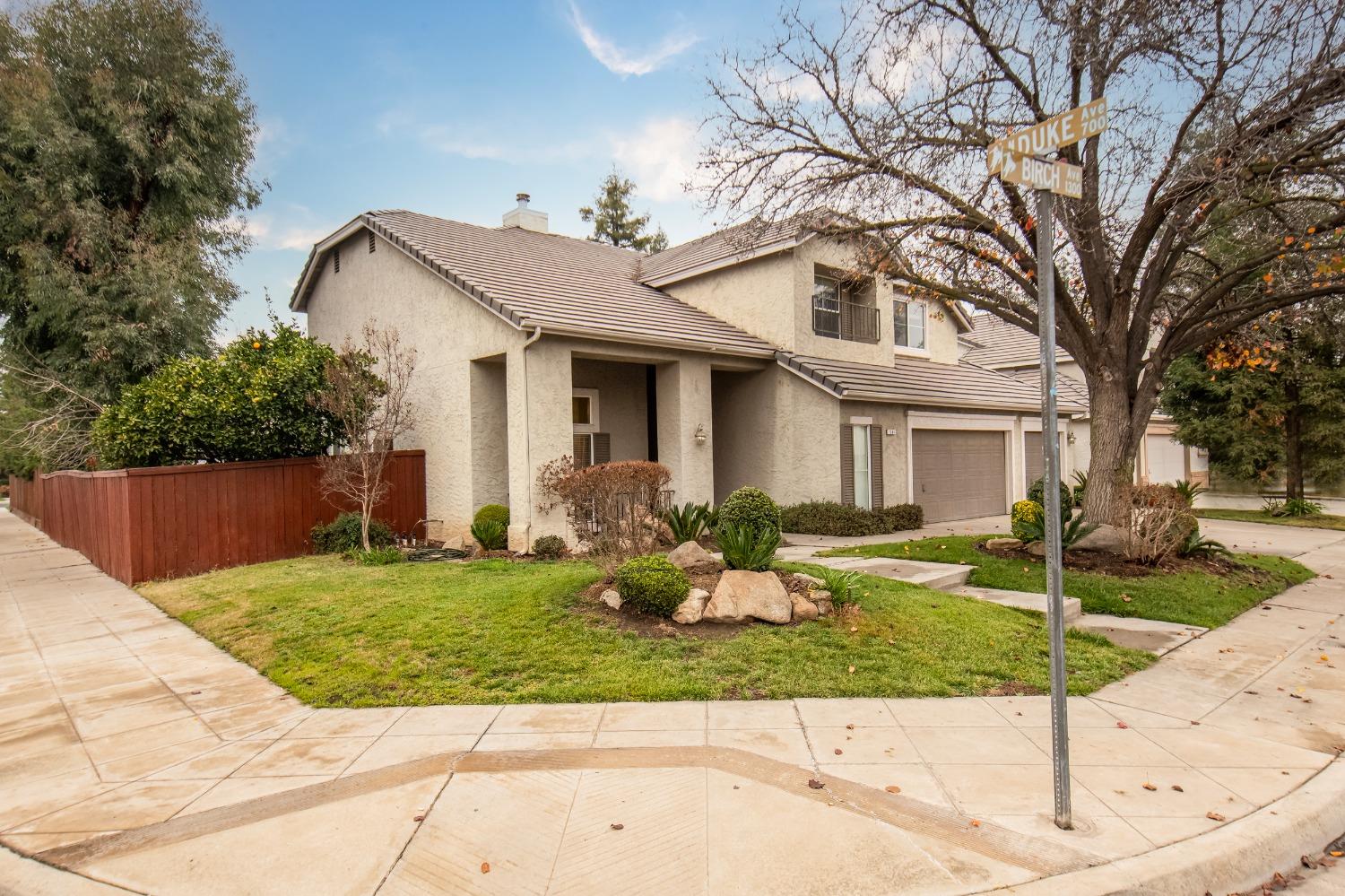 1361 Birch Avenue Clovis, CA 93611 - Photo 3 of 43 a front view of a house with garden