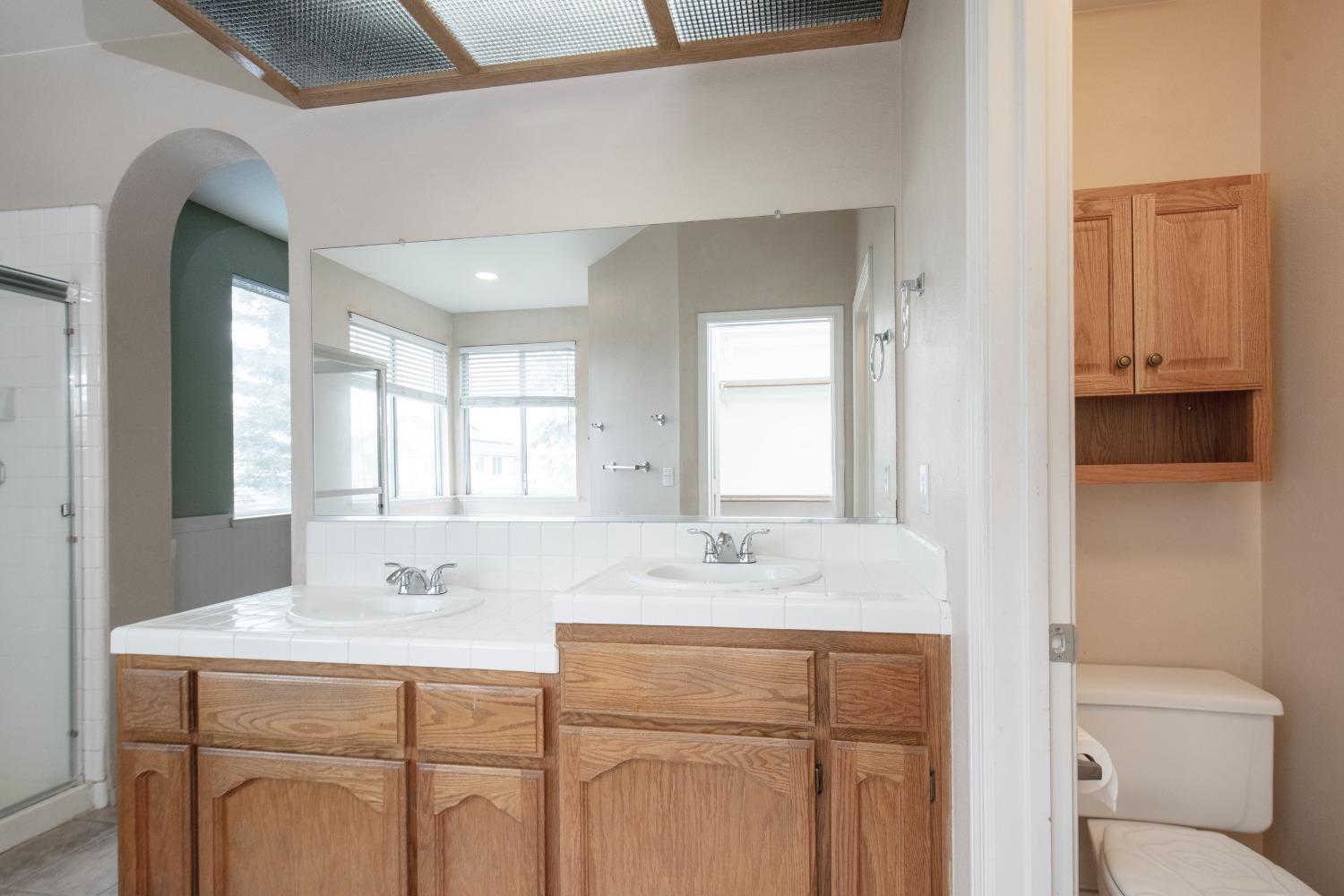 1361 Birch Avenue Clovis, CA 93611 - Photo 39 of 43 a bathroom with a sink double vanity and a mirror