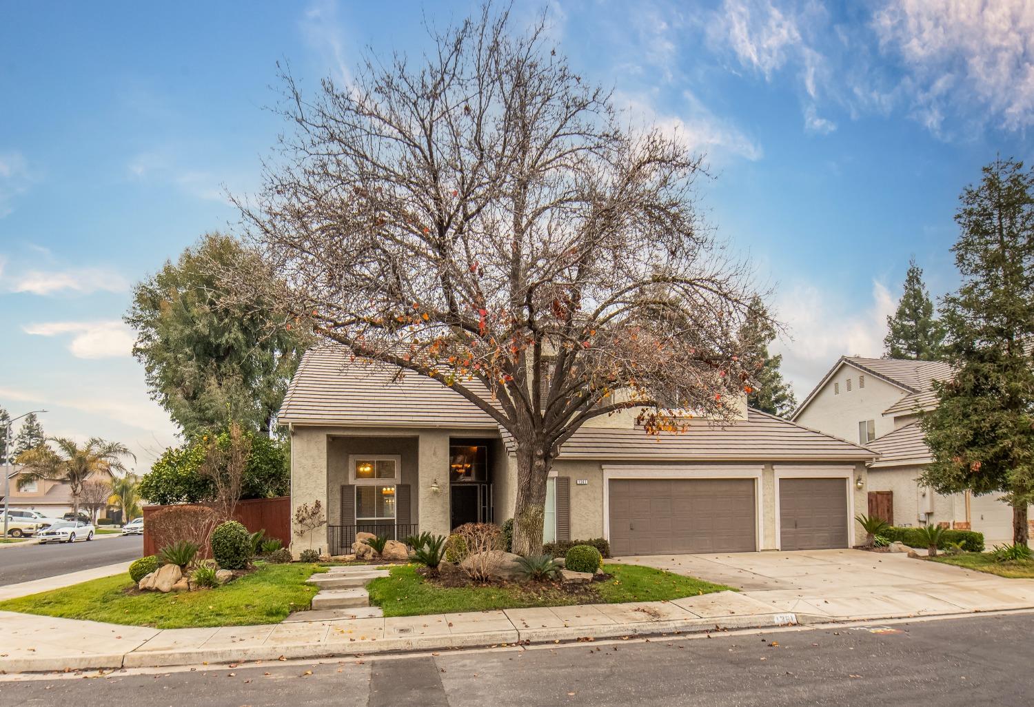 1361 Birch Avenue Clovis, CA 93611 - Photo 4 of 43 a front view of a house with yard and trees