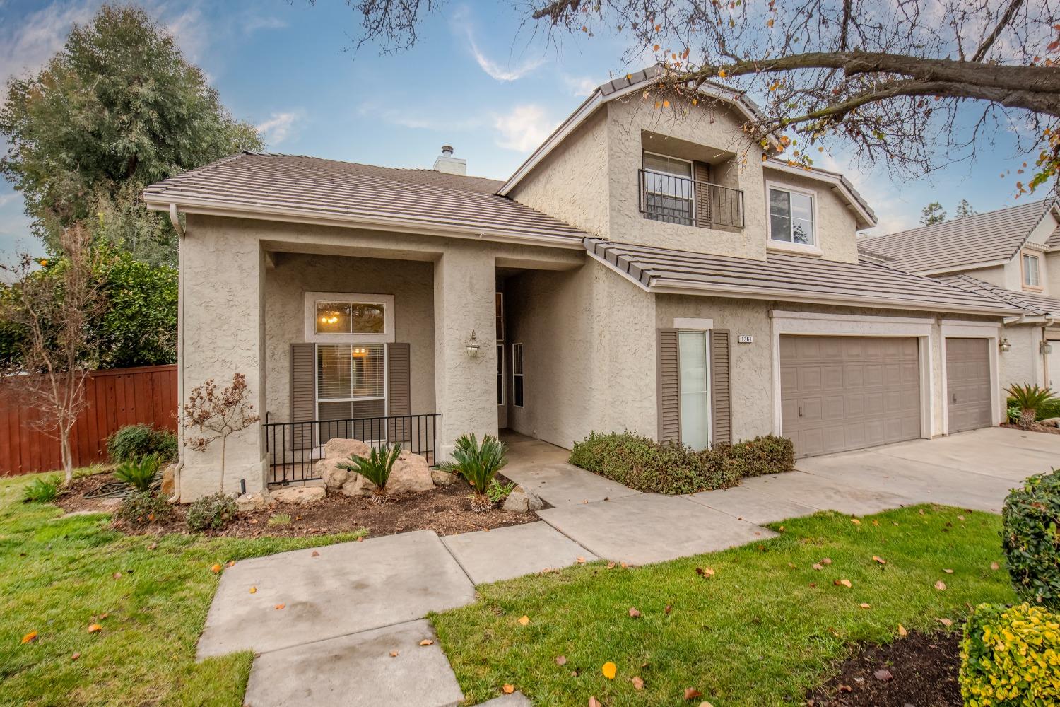 1361 Birch Avenue Clovis, CA 93611 - Photo 5 of 43 a front view of a house with garden