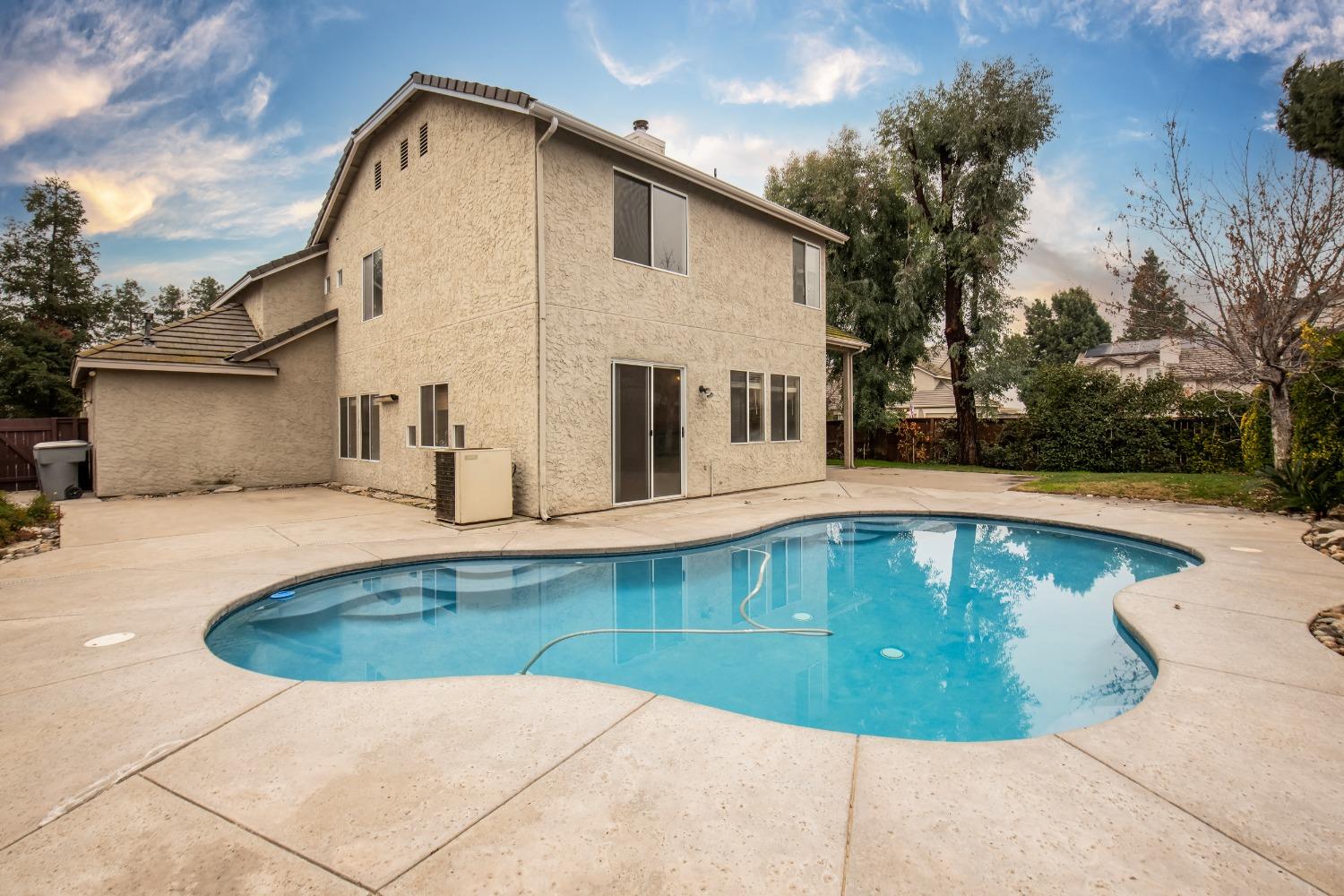 1361 Birch Avenue Clovis, CA 93611 - Photo 8 of 43 a view of a house with swimming pool