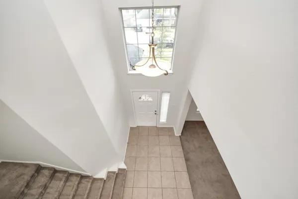 a view of a hallway with a window