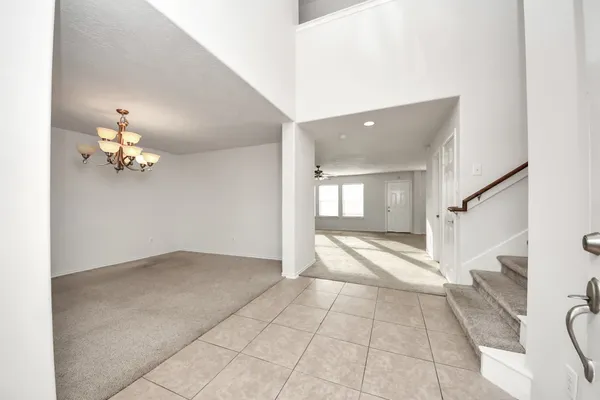 a view of livingroom with hardwood floor and kitchen view