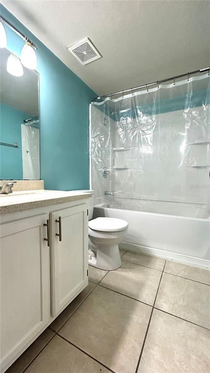 5855 Southwest 8th Place Gainesville, FL 32607 - Photo 3 of 19 a bathroom with a sink a toilet and shower