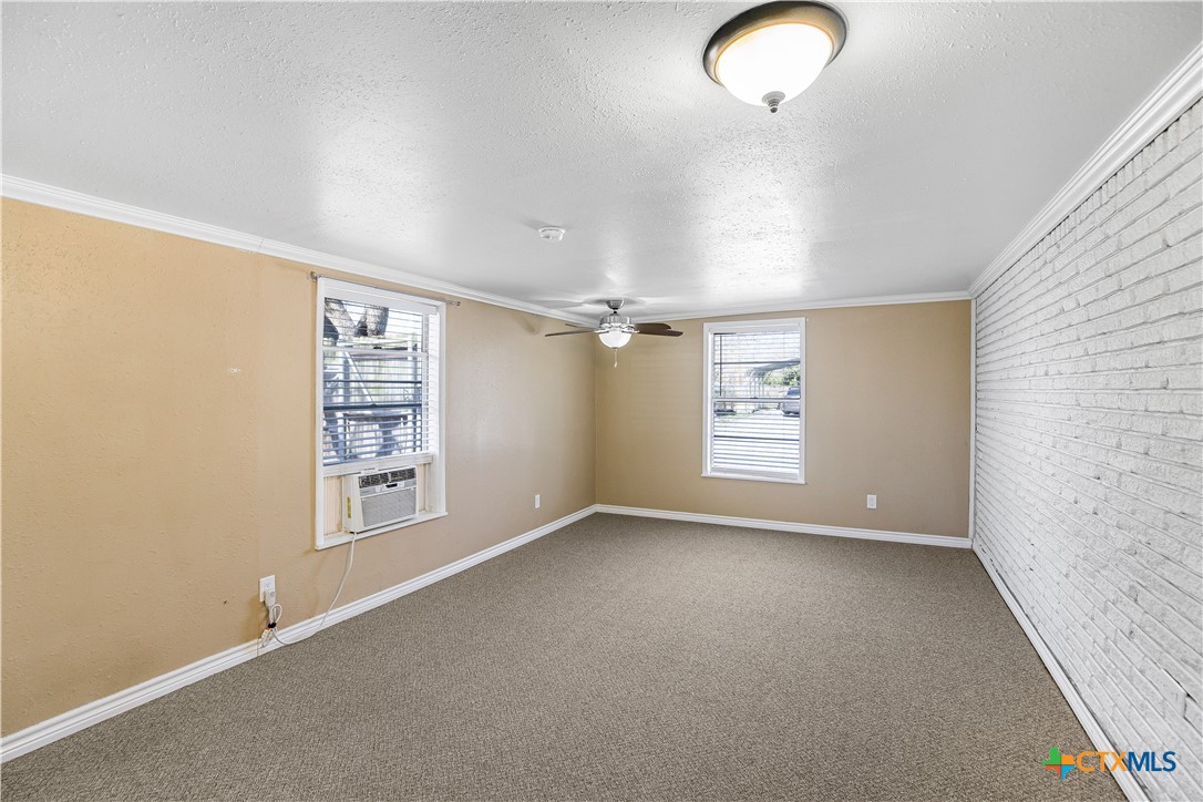 121 Bonham Street Port Lavaca, TX 77979 - Photo 18 of 26 an empty room with windows and closet