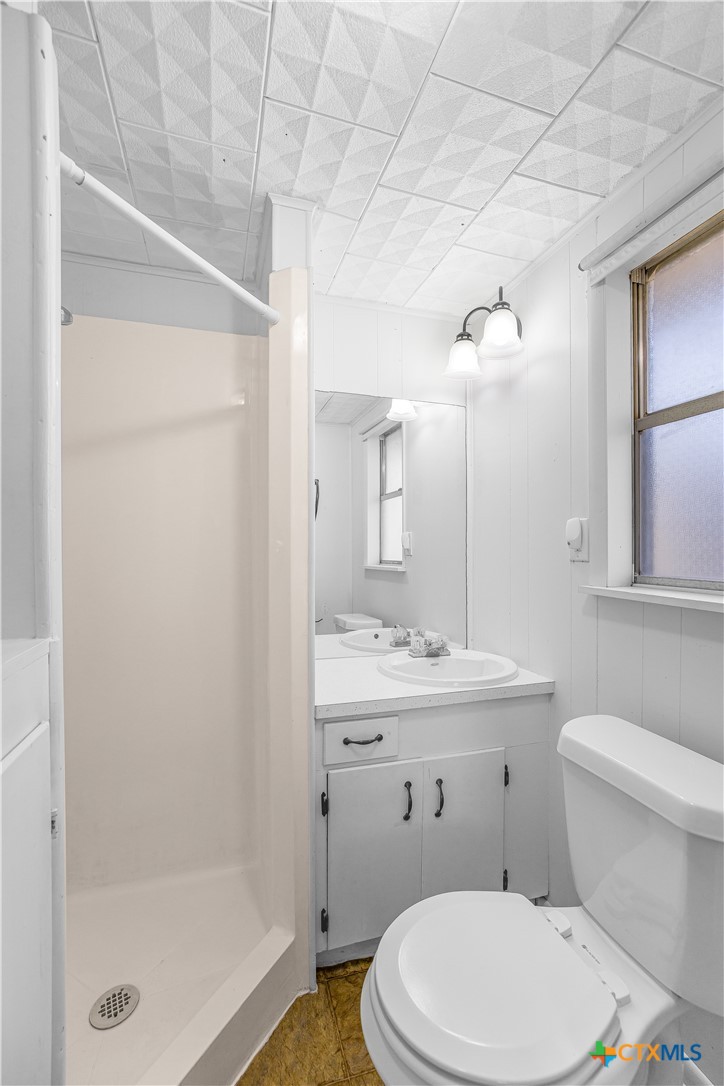 121 Bonham Street Port Lavaca, TX 77979 - Photo 20 of 26 a bathroom with a sink a toilet and shower