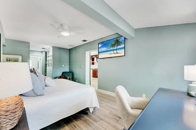 a bedroom with a bed and a couch