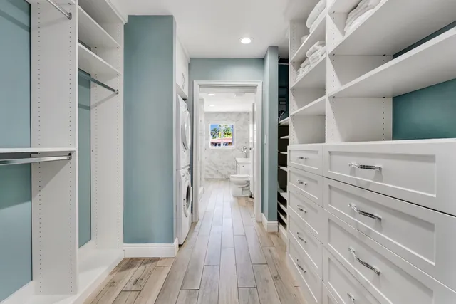 a view of hallway with wooden floor