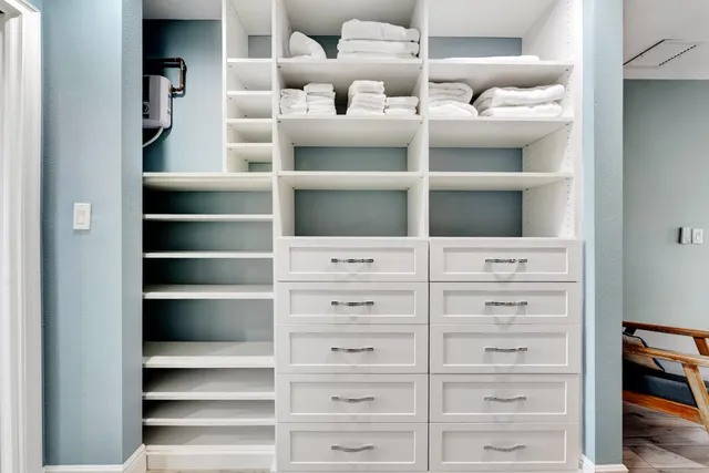 a view of an empty walk in closet