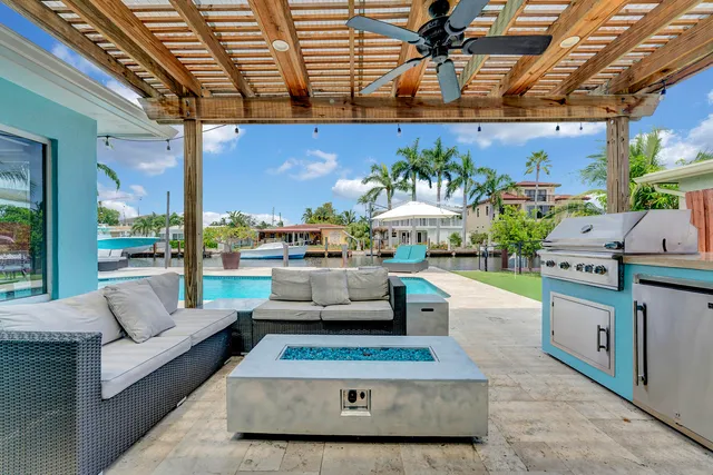 a living room with furniture and flowers
