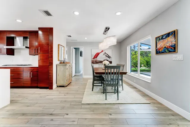 a dining room with furniture and window