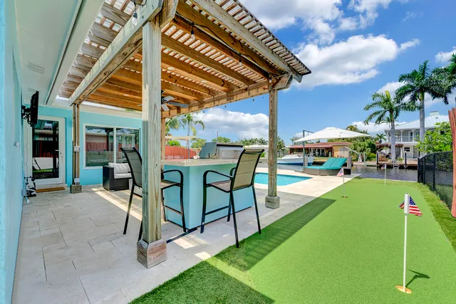 a view of an chairs and tables in the patio