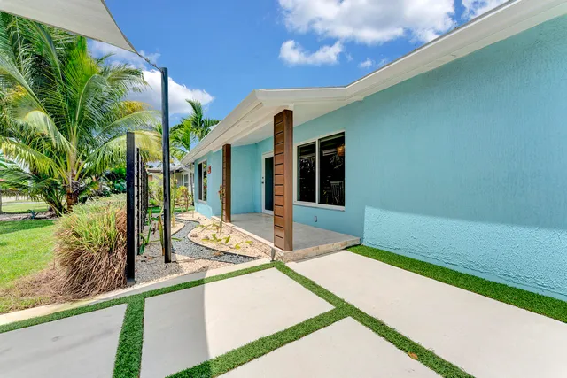 a house view with a backyard space
