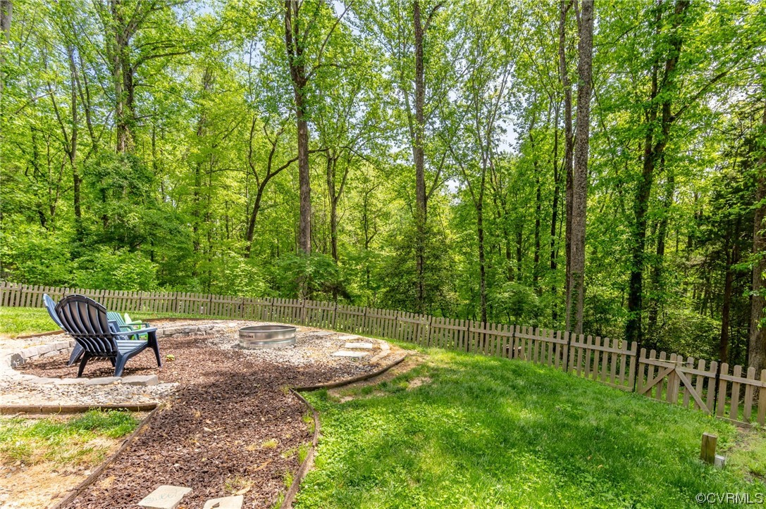 353 Nottoway Lane King William, VA 23086 - Photo 14 of 33 a view of a chair and table in the backyard