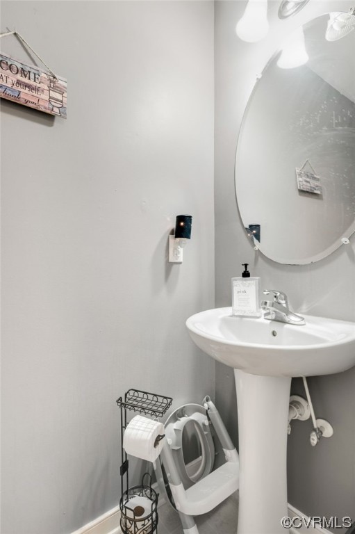 353 Nottoway Lane King William, VA 23086 - Photo 18 of 33 a bathroom with a sink a mirror and toilet