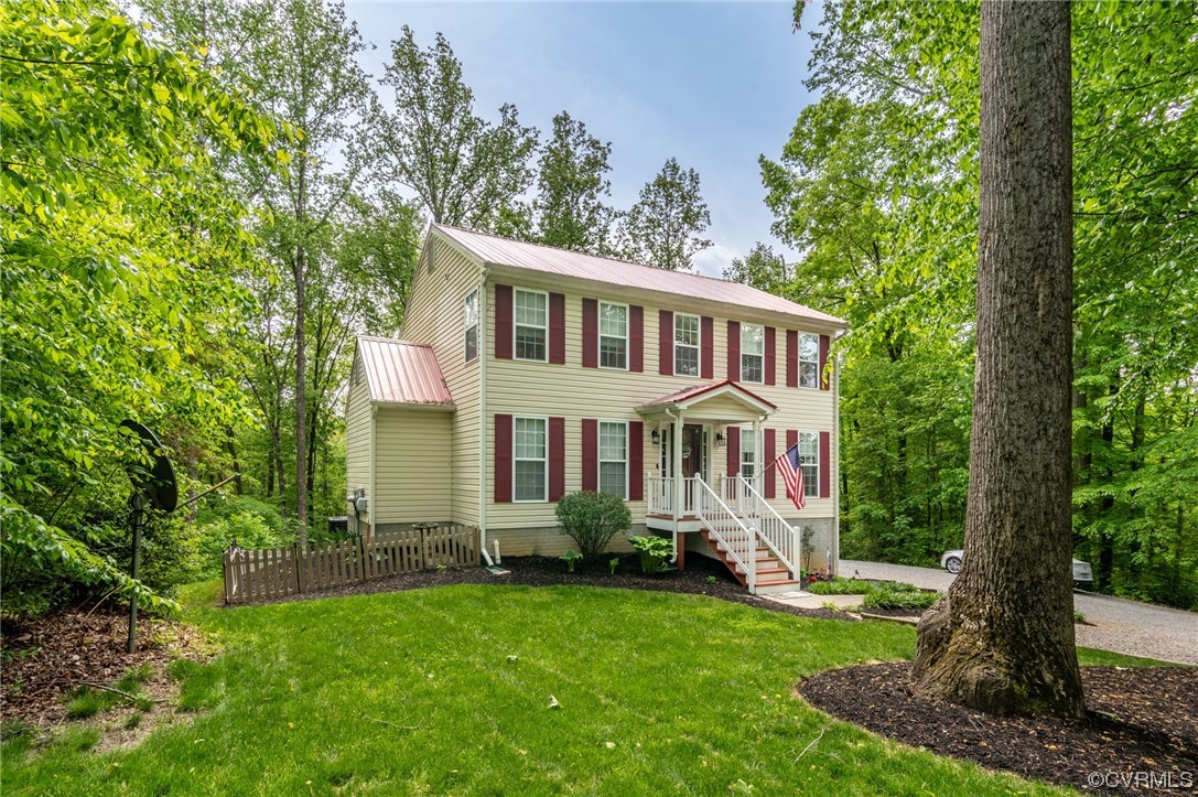 353 Nottoway Lane King William, VA 23086 - Photo 2 of 33 a front view of a house with a garden