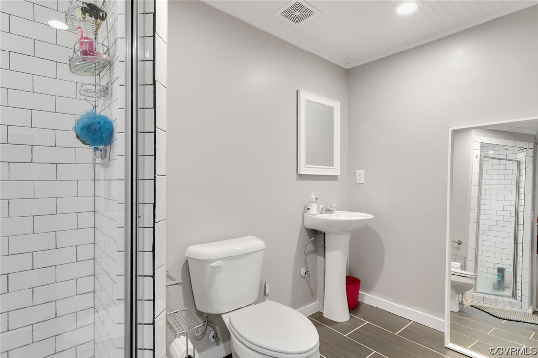 353 Nottoway Lane King William, VA 23086 - Photo 29 of 33 a white toilet sitting next to a bathroom sink