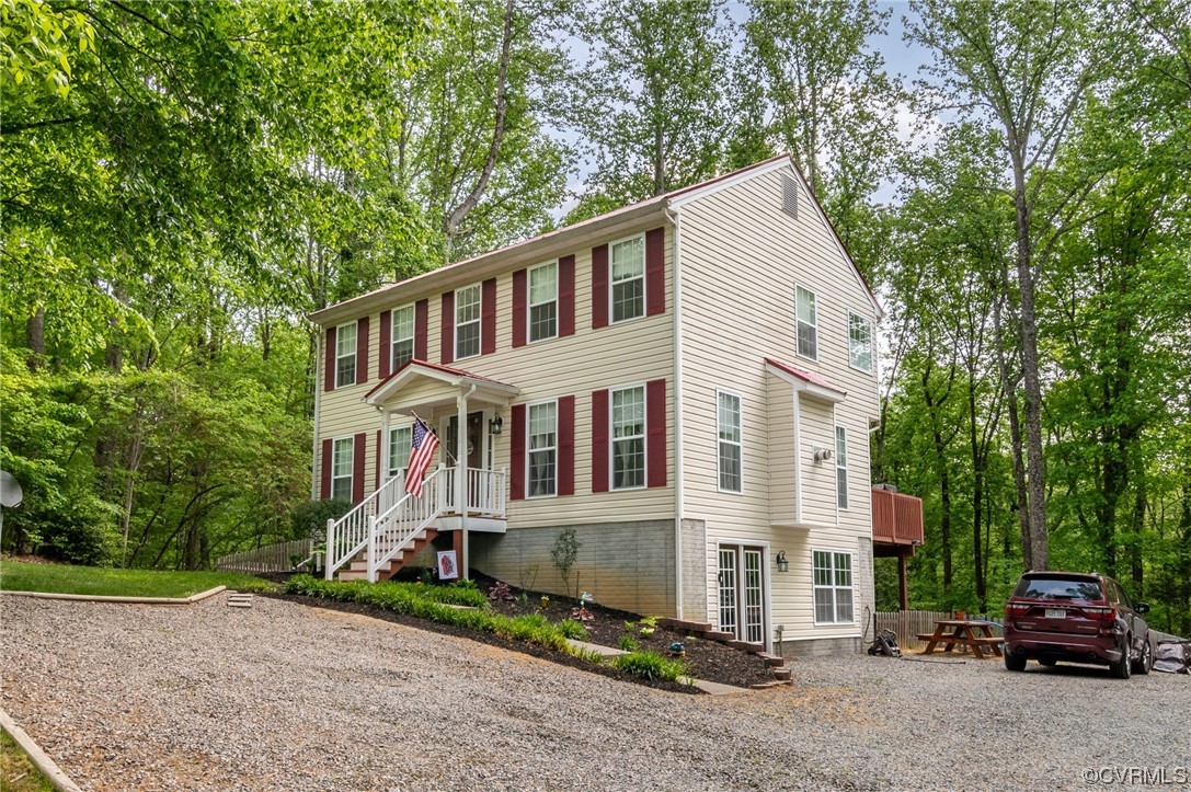 353 Nottoway Lane King William, VA 23086 - Photo 3 of 33 front view of a house with a garden
