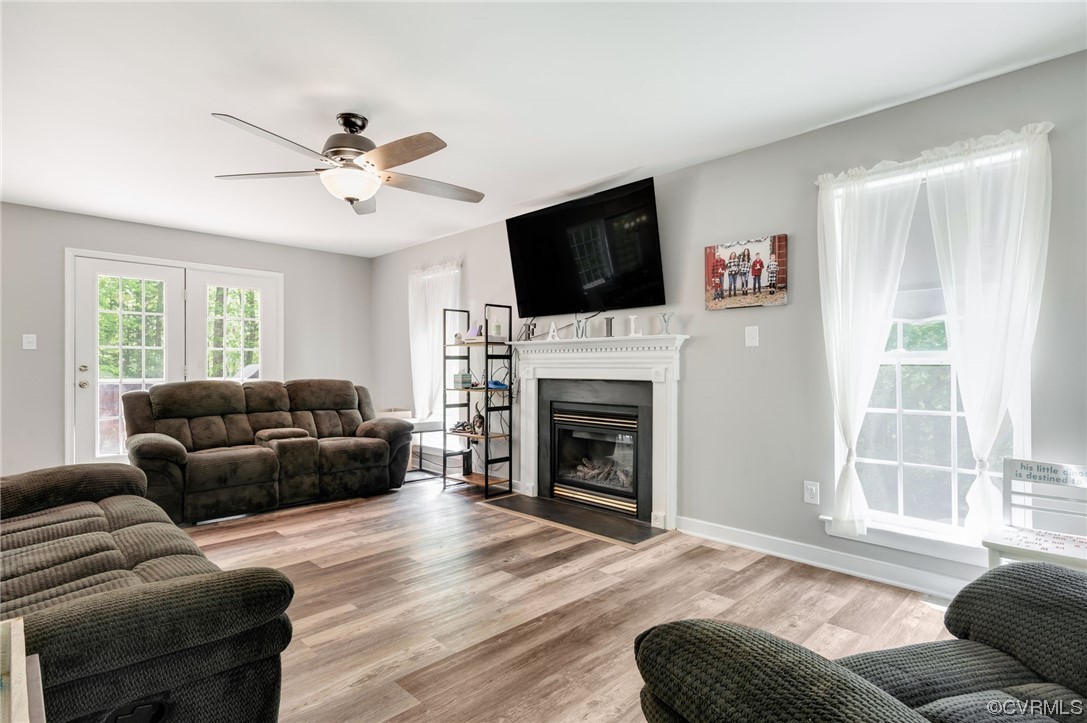 353 Nottoway Lane King William, VA 23086 - Photo 5 of 33 a living room with furniture a fireplace and a flat screen tv